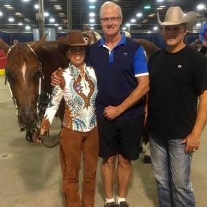 This is Kim Blythe with her horse Lil Bit Sleepy, her husband, Craig, and trainer Kip Larson. 