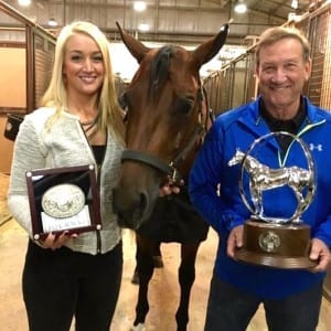 Jenna Dempze and her proud father with their Junior Western Pleasure Reserve World Champion, Rewind and Repeat. 