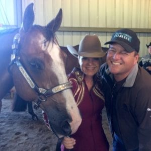 Dana Azevedo, an amateur exhibitor from American Canyon, CA, is showing three horses and in both arenas. Pictured here with Dryfuss and her trainer, Mike Weaver.